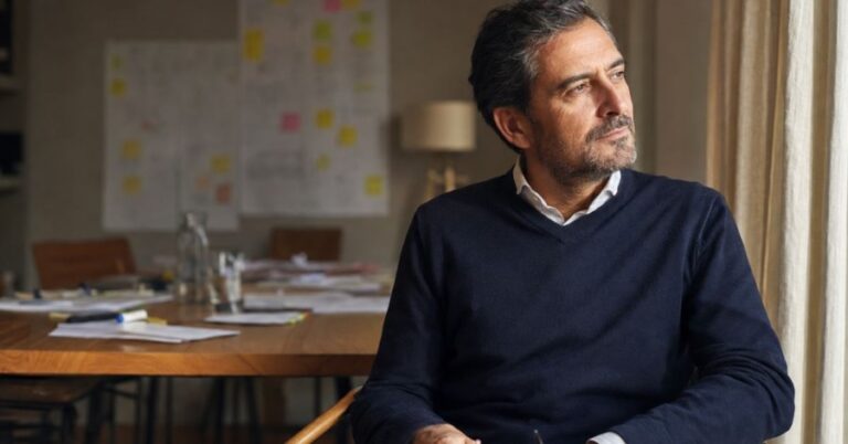 Experienced male business leader reflecting after an international strategy session.